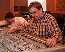 A picture of David R. Ferguson at a mixing board.