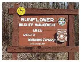 A sign for Sunflower Wildlife Management Area in Delta National Forest.