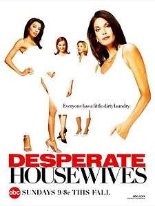 Four women – two brunettes, a redhead and a blonde – in white dresses are posing in front of a white background. There is a caption placed in the middle of them: "Everyone has a little dirty laundry." Below them, the word "DESPERATE", in red, follows the word "HOUSEWIVES", in black. At the bottom left corner, a red circle with the letters "abc" inside, follows the phrase "SUNDAYS 9/8c THIS FALL". At the bottom right corner is an internet URL "abc.com", followed by the phrase "keyword:housewives".