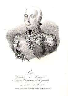 Black and white print of a white-haired man in an early 1800s military uniform. He wears a high collared coat with epaulettes and a large amount of gold braid.