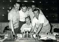 1957 B&W photograph of Donn Reynolds (far left) in recording studio with George Morgan, Wesley Rose, Boudleaux Bryant, and Eddy Arnold (Nashville, Tennessee).