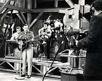 1962 B&W photograph of Donn Reynolds performing on the set of Cross Canada Barndance (Winnipeg, Manitoba, Canada).