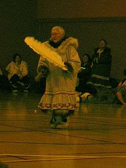 Female dancer in costume performing in front of an audience
