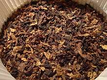 Ready rubbed pipe tobacco inside a round 100g tin