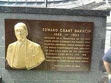 A plaque commemorating "Edward Grant Barrow" attached to a marble wall