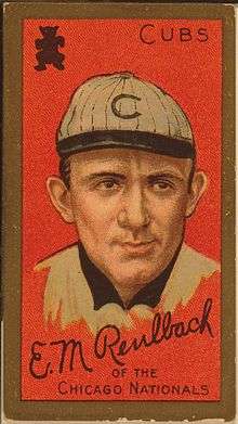 Baseball card showing a head shot of a man facing forward wearing a white hat with a "C" on it.  The card says "Cubs" in the upper right corner and says "Ed Reulbach of the Chicago Nationals" on the bottom.