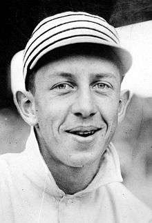 Black and white photo of Eddie Collins in close up, wearing a 1911 Philadelphia Athletics cap