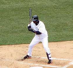 Rentería crouching during an at bat while with the Detroit Tigers.