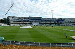 Interior view of the Edgbaston cricket stadium with a small number of people in the stands
