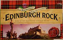 A box with a red tartan background, and image of Edinburgh Castle and in large letters across the middle, "Edinburgh Rock".