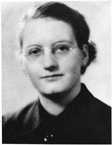 A young woman in glasses
