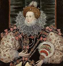 A three-quarter portrait of a middle-aged woman wearing a tiara, bodice, puffed-out sleeves, and a lace ruff.  The outfit is heavily decorated with patterns and jewels.  Her face is pale, her hair light brown.  The backdrop is mostly black.