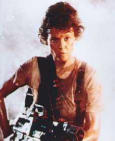 A serious-looking Sigourney Weaver with a gun