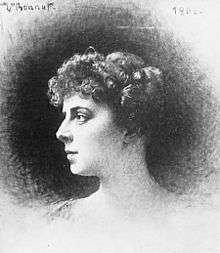A woman's head and shoulders in profile looking to the left, with short, curled hair