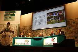 A conference between the organizations of UEFA and Soccerex taking place.