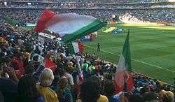 A view of an Italian fan waving his national flag.