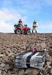 The DARPA - US Army telerobot "Solon" and Crew 3 explore Devo Rock canyon on July 26, 2001.