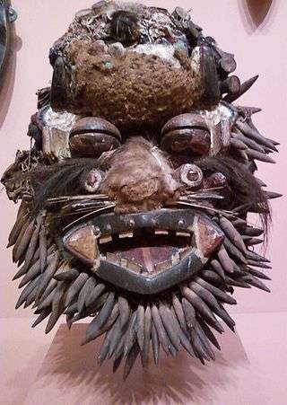 A Wee face mask designed to look like a leopard. On display at the Indianapolis Museum of Art