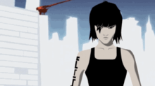 An Asian woman wearing a black shirt is visible in the right-hand side of the image. She has tattoos around her left eye and on her right arm. White buildings and a red construction crane are visible in the background beneath a dark blue sky.