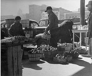 Farmers and their produce at the City Market, c. 1950.