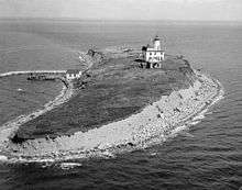 A black and white photograph of Faulkner Island Light