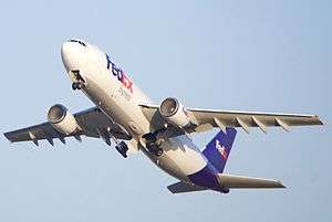 FedEx Airbus A300 with condensation in both intakes, gear retracting