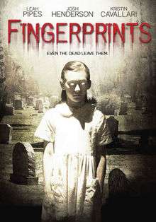 The DVD cover shows a zombie like older girl in a white short sleeve dress looking down in a graveyard, the movie title is written in blood that is leaking down