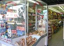 Deli window displaying breads and other foods
