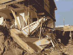 A picture of a damaged beach house