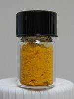 Folic acid as a yellow-orange crystalline powder