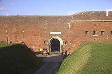 A front facing view of Fort Nelson, one of the old Palmerston Forts which circle the town. The fort itself is made up of a large, plain brick wall.