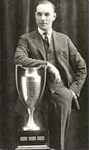 Man in suit with trophy