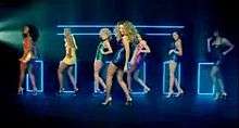 Knowles dancing with several background female dancers in a studio