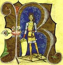 A young crowned man wearing a shield