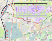 A map of the Heathrow airport area, with a curved solid black line starting from the northern runway and ending southwest of the airfield, near a pond; red numbers from 0 to 150 are marked along the black line.