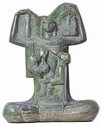 A bronze statue by Egyptian artist Gamal Sagini showing a mother breastfeeding her infants