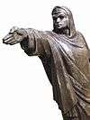A bronze statue by Egyptian artist Gamal Sagini showing a woman standing with her fist closed and her hand directed straight forward