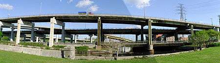 Two elevated roadways with two connecting ramps above a river