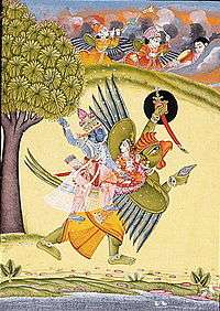 Vishnu and Laksmi riding on a giant winged creature, the Garuda
