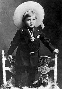 Photo of Gary Cooper dressed as a cowboy at the age of two