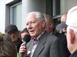 Gay Byrne speaking into a microphone in 2007