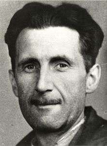 A black-and-white photograph of Orwell: a Caucasian man with a thin mustache