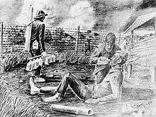 A black-and-white pencil drawing of a man giving another a drink from a canteen. They are located in an enclosure surrounded by barbed wire with guards holding guns patrolling the perimeter.