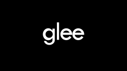 A black background with the word "Glee" centered and written in white lowercase letters