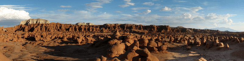 hundreds of sandstone hoodoos protruding from the desert floor.
