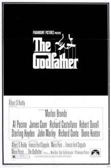The Godfather written on a black background in stylized white lettering, above it a hand holds puppet strings