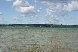 View of Grand Traverse Bay from East Arm looking West on a partially cloudy day.
