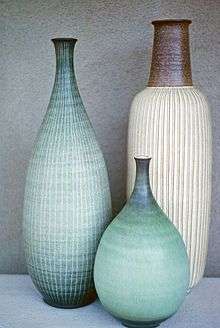 Three hand-thrown ceramic vases with sgraffito designs, made by McIntosh in 1962.