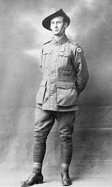 A black-and-white photograph of a World War I-era soldier wearing a slouch hat and field uniform