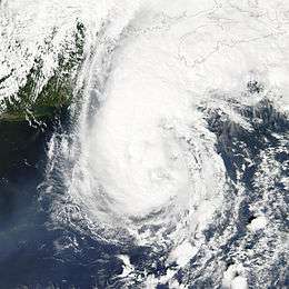 A view of Hurricane Gustav from Space on September 11, 2002. The storm is located over the open ocean, and is approaching landfall in Canada. New England is seen on the left side of the image.